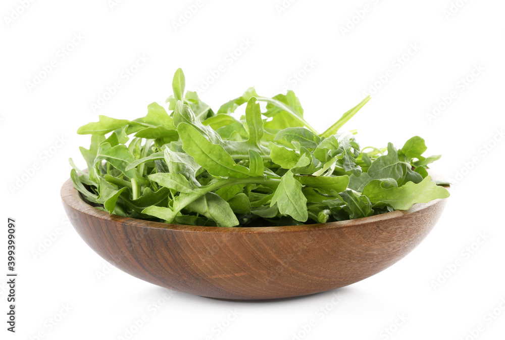 Delicious fresh arugula in wooden bowl isolated on white Delicious fresh arugula in wooden bowl isolated on white