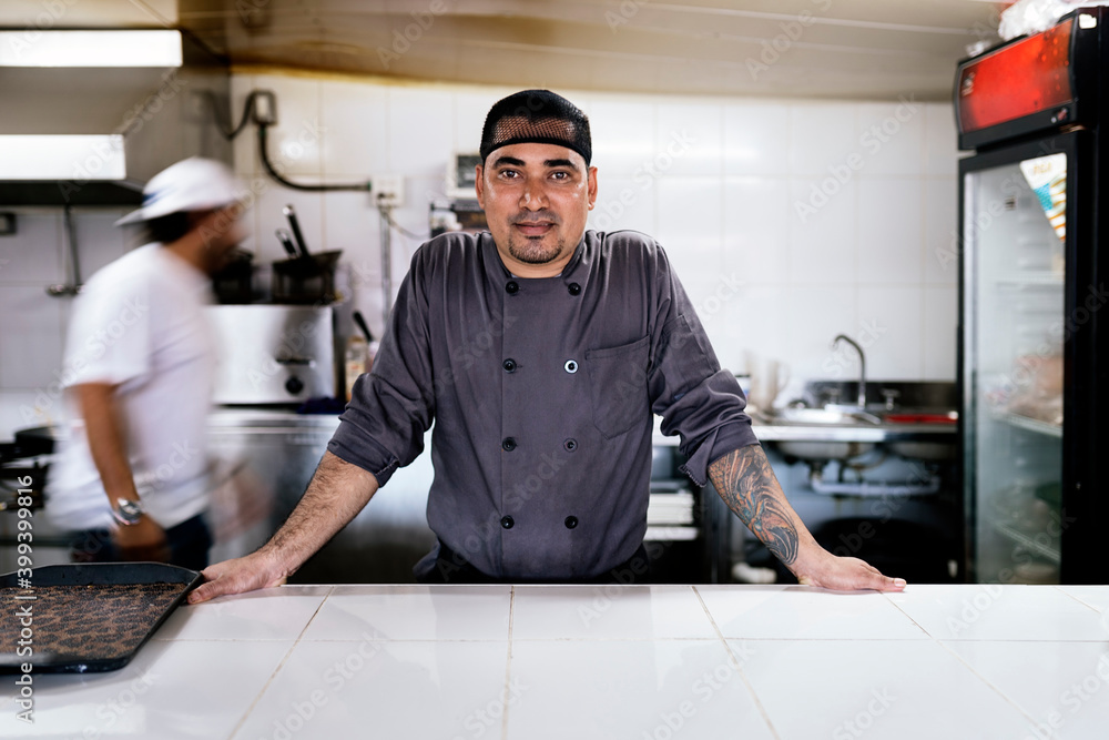 Chef standing and smiling at camera. Chef standing and smiling at camera.