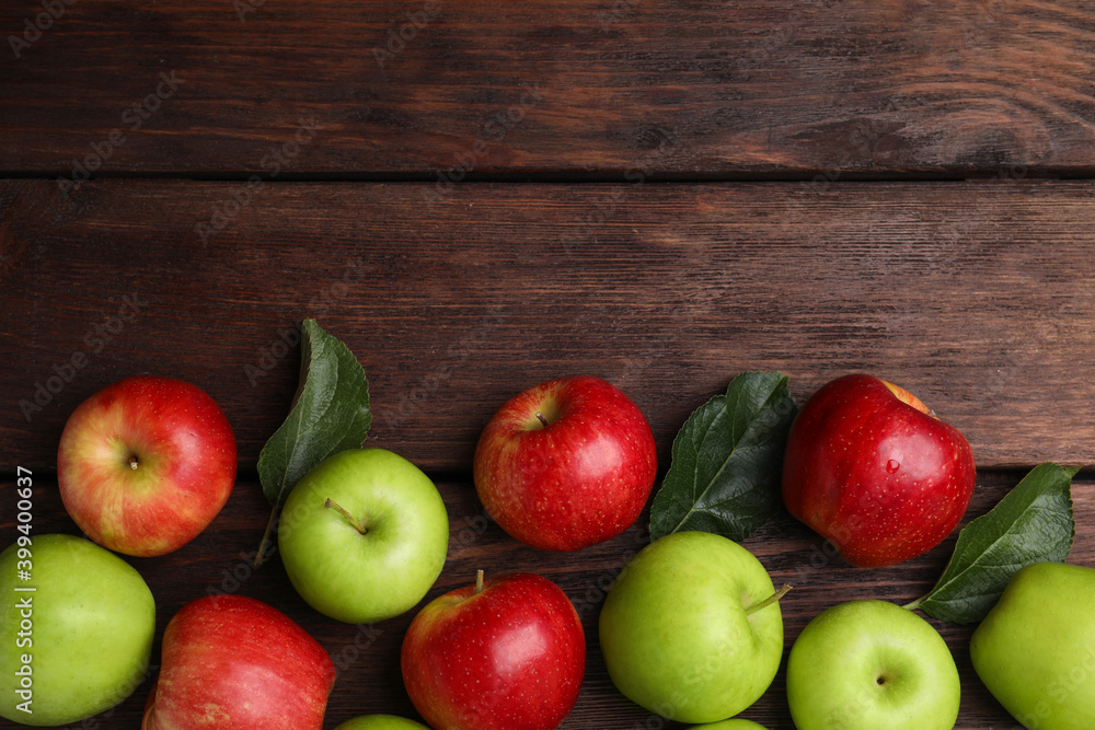 Fresh ripe apples on wooden table, flat lay. Space for text Fresh ripe apples on wooden table, flat lay. Space for text