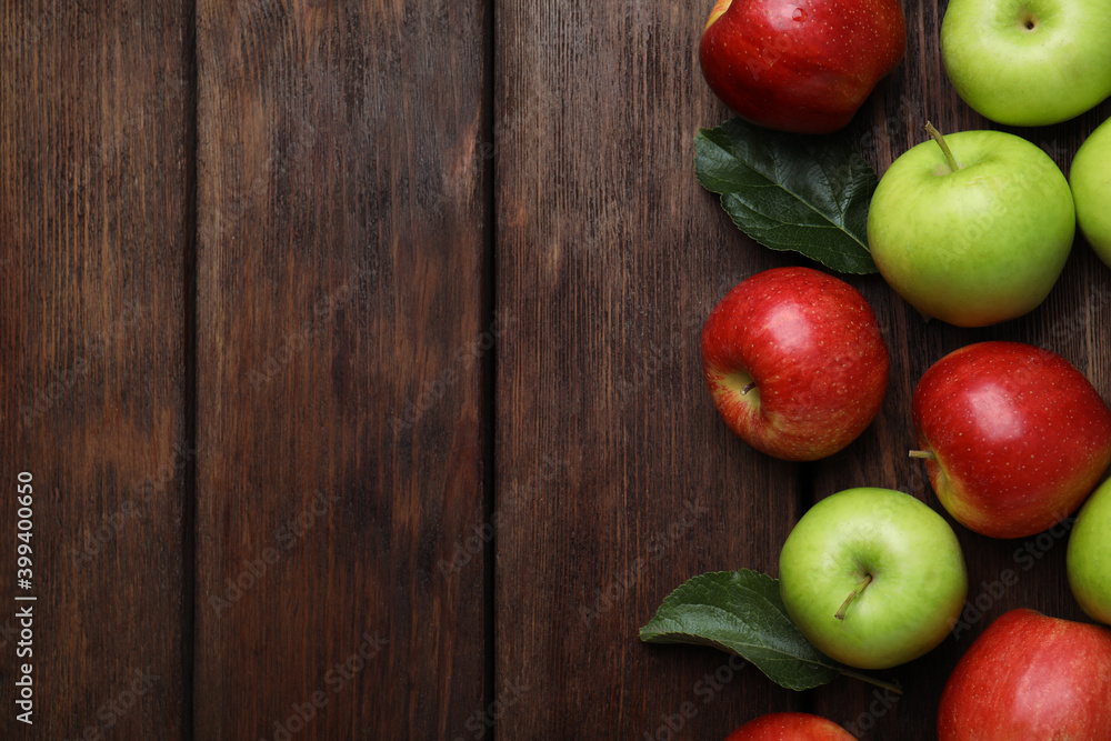 Fresh ripe apples on wooden table, flat lay. Space for text Fresh ripe apples on wooden table, flat lay. Space for text