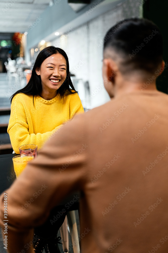 Chinese woman smiling at her boyfriend. Chinese woman smiling at her boyfriend.