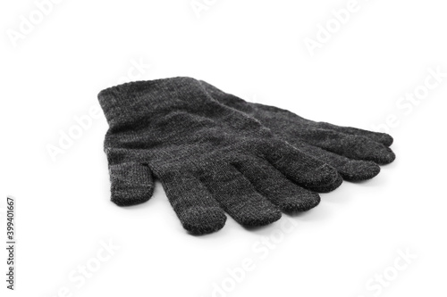 Grey woolen gloves on white background. Winter clothes