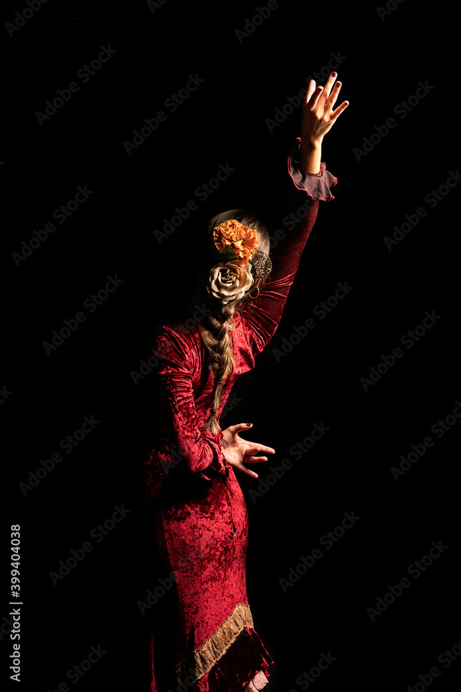 Young woman dancing flamenco on black Young woman dancing flamenco on black
