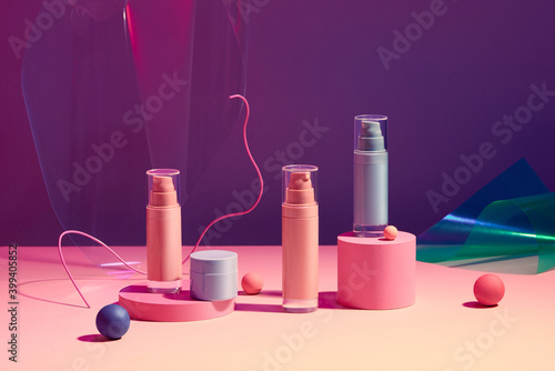 Multi colored containers for cosmetic bottle photo