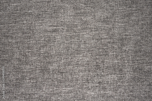 Gray fabric background. Grey canvas texture. Bright textile material background. Gray fiber pattern. Checkered textile texture.
