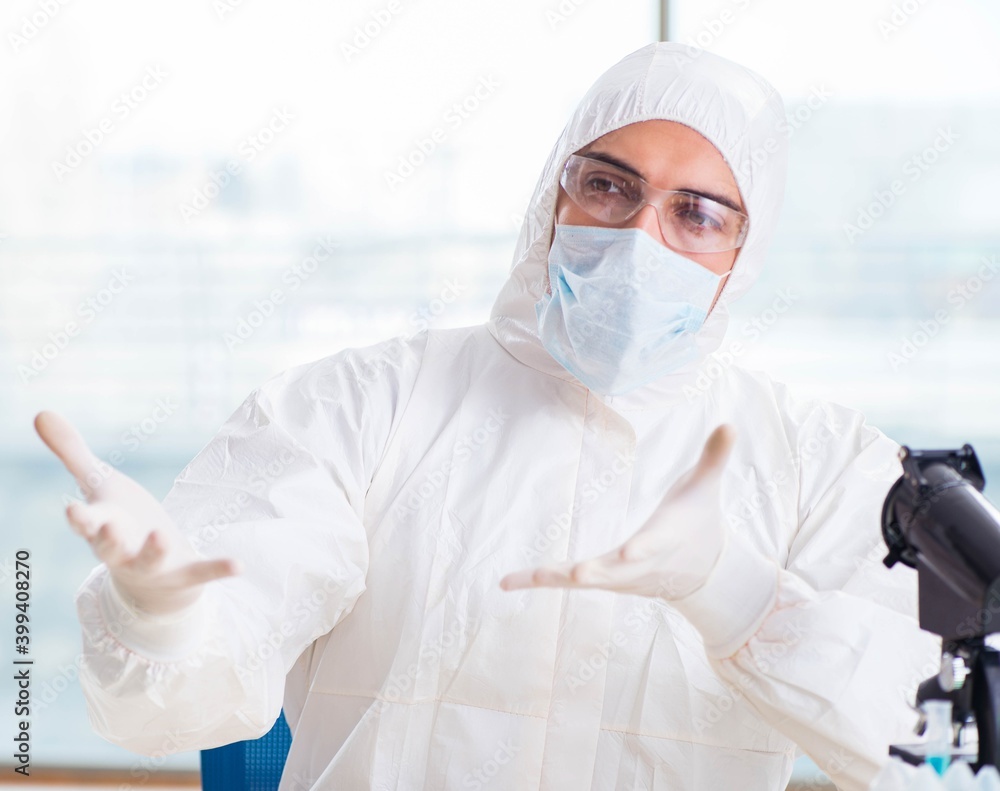 Young chemist student working in lab on chemicals Young chemist student working in lab on chemicals