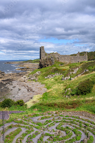 UK, Scotland, Abandoned garden with ruins of Dunure Castle in background photo