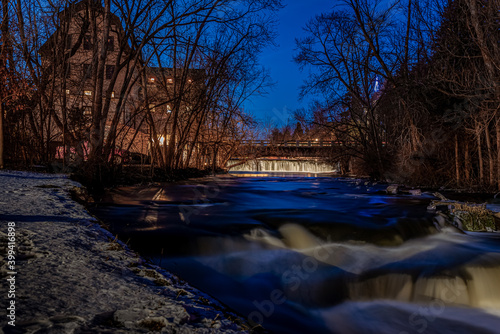 Cedarburg, WI  USA - December 14, 2020: The old mill and dam in Cedarburg Wisconsin decorated for the holidays photo