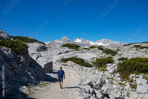 Senior man hiking at Hoher Dachstein during summer photo