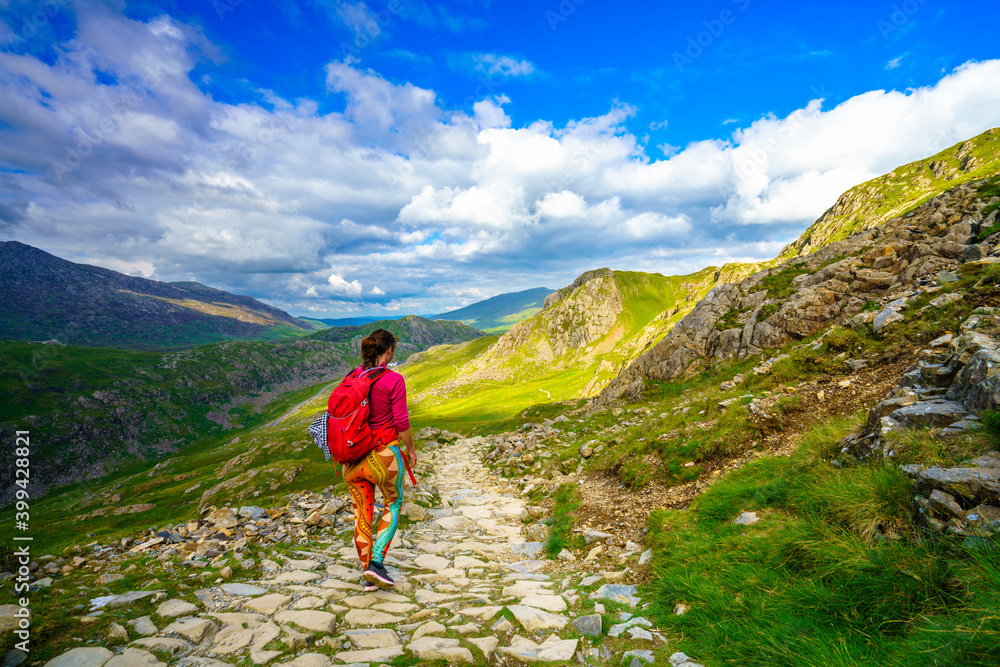 Fototapeta premium Tourist hiking mountains in Snowdonia, North Wales 