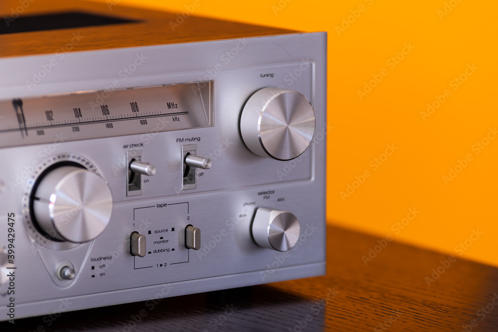 Fototapeta premium Vintage Audio Stereo Receiver Huge Shiny Metal Volume Tuning Knob Closeup