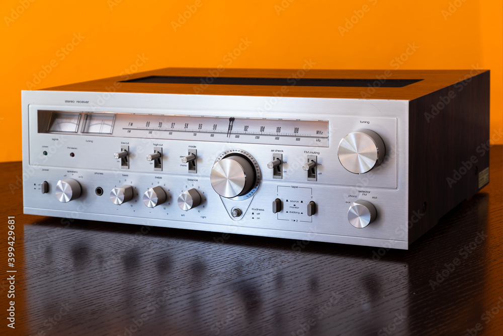 Fototapeta premium Vintage Audio Stereo Receiver with shiny metal front panel