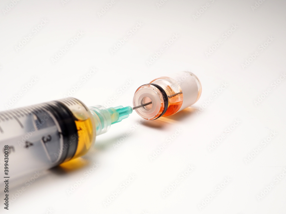 Close up shoot of vaccine on a bottle, capture on white isolated background Close up shoot of vaccine on a bottle, capture on white isolated background