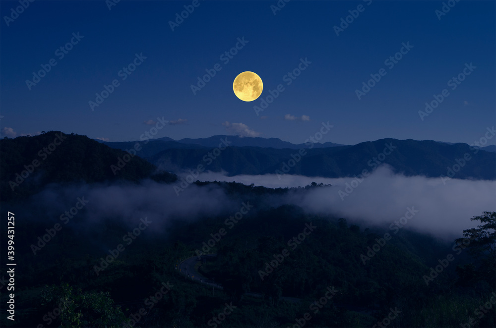 Bright full moon over the mountains in lonely night