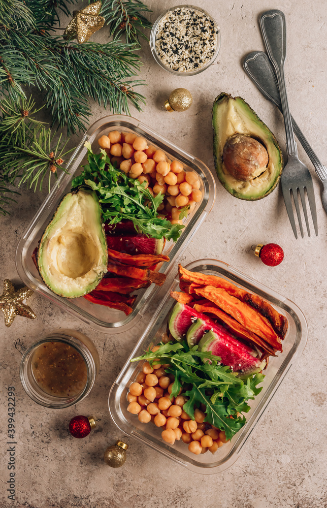 Vegan healthy meal prep containers. Chickpeas, sweet potatoes, arugula, radish and avocado for lunch Vegan healthy meal prep containers. Chickpeas, sweet potatoes, arugula, radish and avocado for lunch