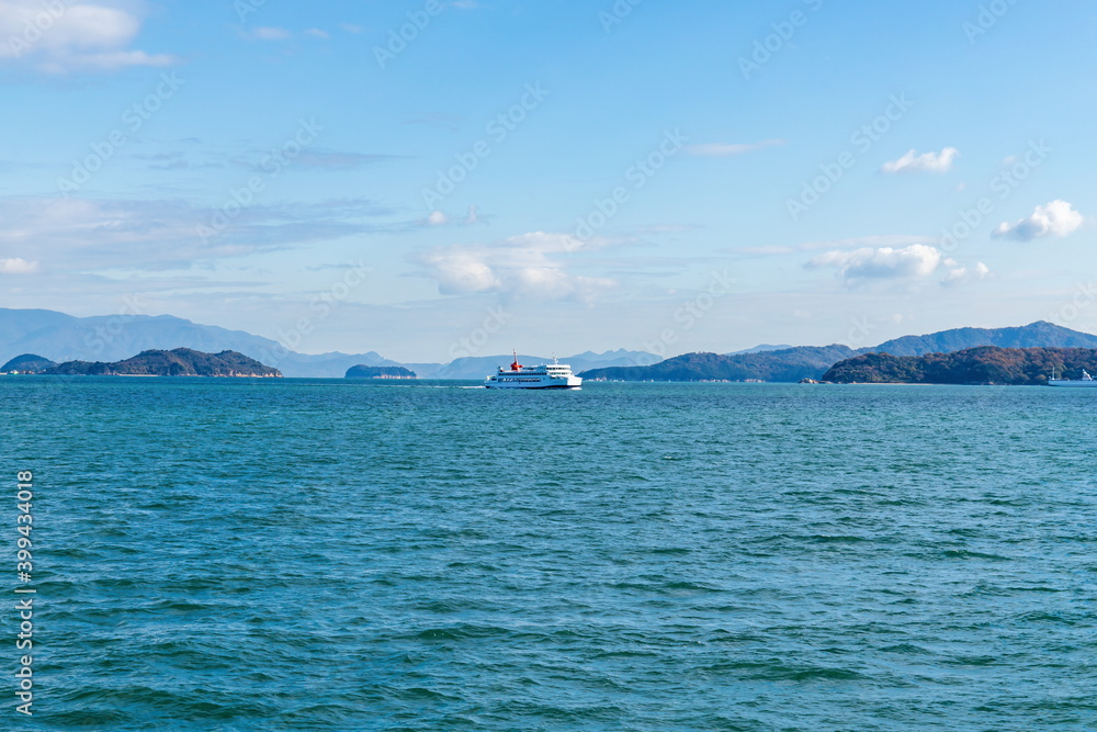 Landscape of the seto inland sea , Ferry sailing between the islands , Takamatsu city, Kagawa, Shikoku, Japan Landscape of the seto inland sea , Ferry sailing between the islands , Takamatsu city, Kagawa, Shikoku, Japan