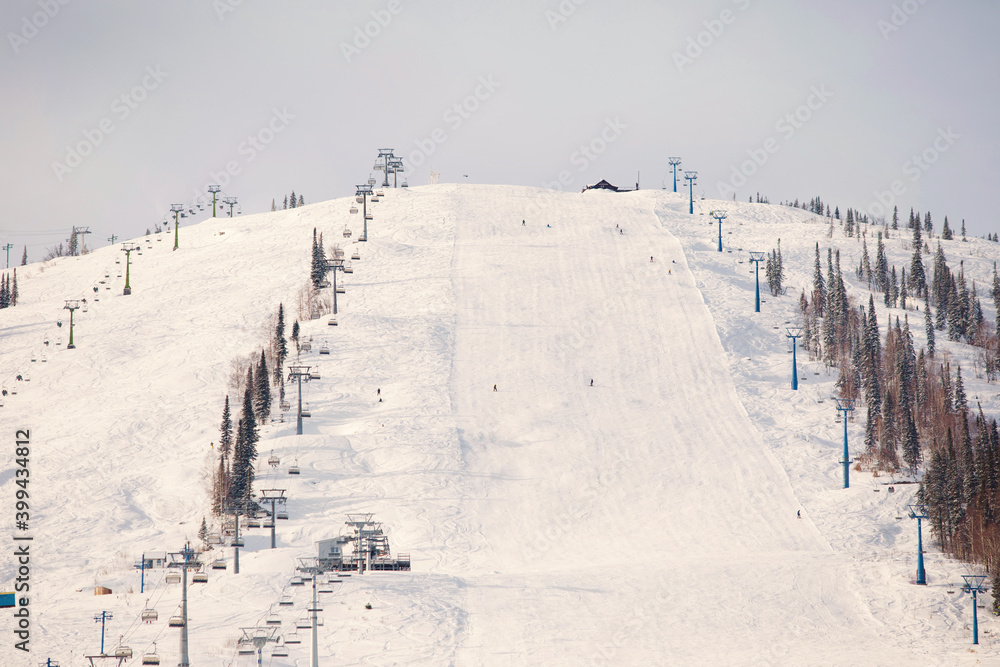 Snowy mountain with ski slopes