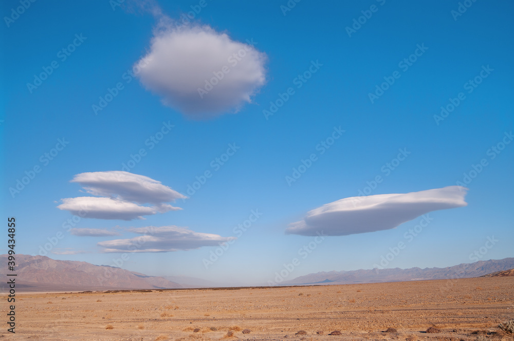 Lenticular cloud during a windy, bright morning in Death Valley National Park in California.