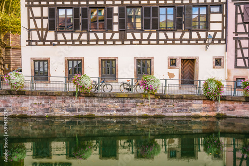 Old town water canal of Strasbourg, Alsace, France. Traditional half timbered houses of Petite France