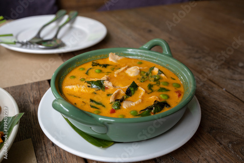 Thai Panang chicken curry in a green bowl