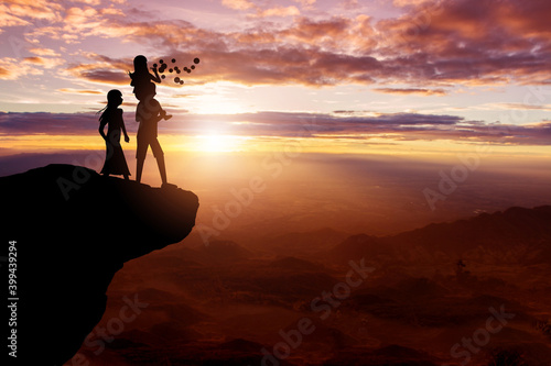 Silhouette of family on the top hills and sky sunset background