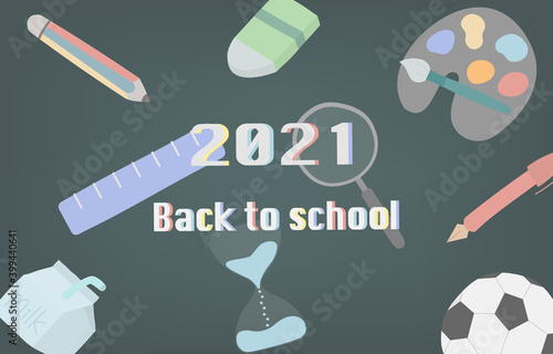 Happy new year on blackboard screen. In the back-to-school concept with supplies such as pens, pencils, erasers, rulers, paint brushes, palettes, balls, hourglass.