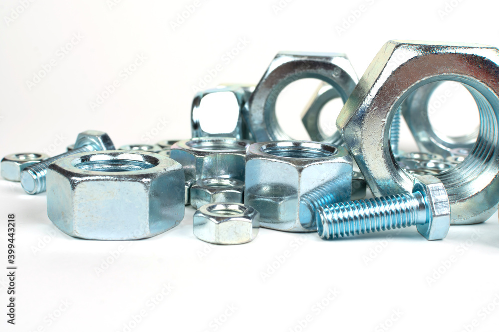 close-up of metal fasteners. bolts and nuts with free space close-up of metal fasteners. bolts and nuts with free space