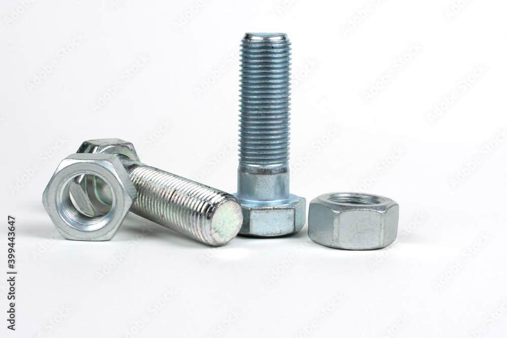 metal bolts of different sizes on a white background metal bolts of different sizes on a white background