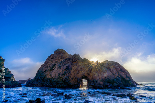 Large Rock, Boulder in Ocean with Keyhole, Waves, Beach photo