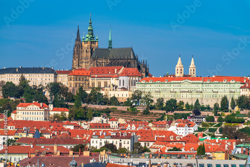 Fotografie Top view of red roofs and Prague's castle in Czech republic