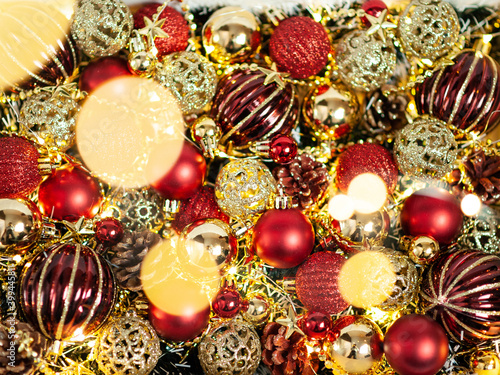 Red and gold Christmas decorations on the Christmas tree in a white box. Close up. Holiday. Happy Christmas.