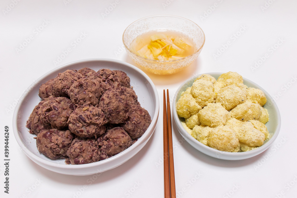 Rice cakes made with bean flour and mashed adzuki beans, Watery Kimchi (mulgimchi, mulkimchi), Korean traditional food, dessert, Injeolmi, tteok, homemade food. Rice cakes made with bean flour and mashed adzuki beans, Watery Kimchi (mulgimchi, mulkimchi), Korean traditional food, dessert, Injeolmi, tteok, homemade food.