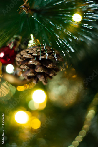 christmas tree in red and gold decorations on a brown background. Gift boxes. Happy Christmas. Side.