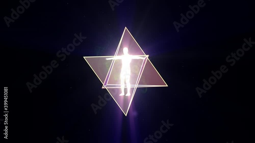 A looped 3D animation of the rotation of two tetrahedrons (Merkaba) inside which is a luminous man. on a dark background. photo