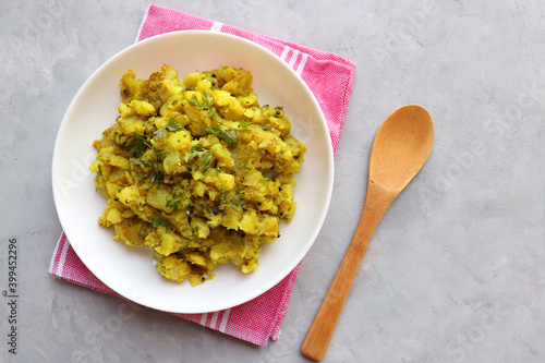 Indian boiled mashed potatoes curry or sabzi. Alu ki sukhi sabzi. Also known as Batatyachi suki bhaji in Marathi. ideal for puri bhaji or vada pav. photo