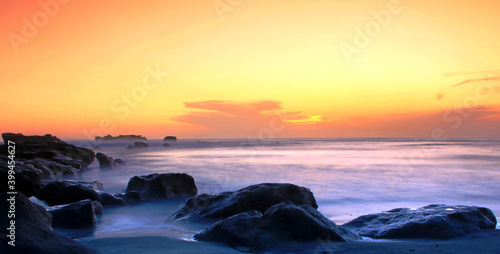 sunset in mengening beach tabanan bali photo