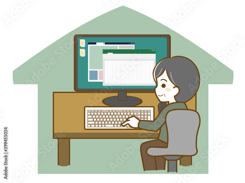 在宅でパソコン作業をする中年男性