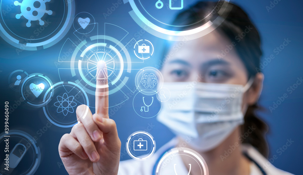 Medical healthcare Asian female doctor touching interacting technology futuristic holographic, surgical protective face mask, information diagnosing patient health stethoscope blue isolated background Medical healthcare Asian female doctor touching interacting technology futuristic holographic, surgical protective face mask, information diagnosing patient health stethoscope blue isolated background