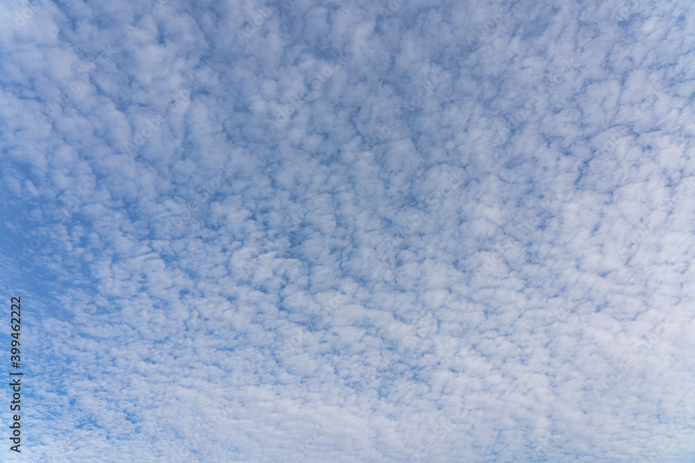 Beautiful mackerel sky or buttermilk sky of white clouds