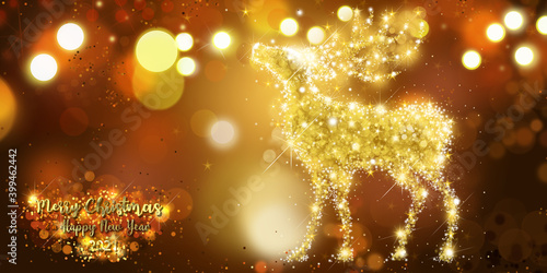 Magical golden deer with twinkling lights and sparkling bokeh effect background for a Merry Christmas and a 2021 Happy New Year