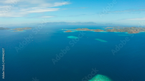 aerial seascape Lagoons with blue, azure water in middle of small islands. Palawan, Philippines. tropical islands with blue lagoons, coral reef. Islands of the Malayan archipelago with turquoise © Alex Traveler