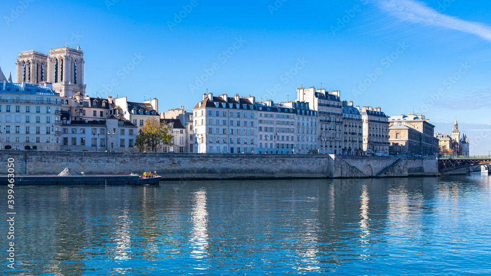 Paris, ile saint-louis and quai aux Fleurs, beautiful ancient buildings, with the Notre-Dame cathedral
