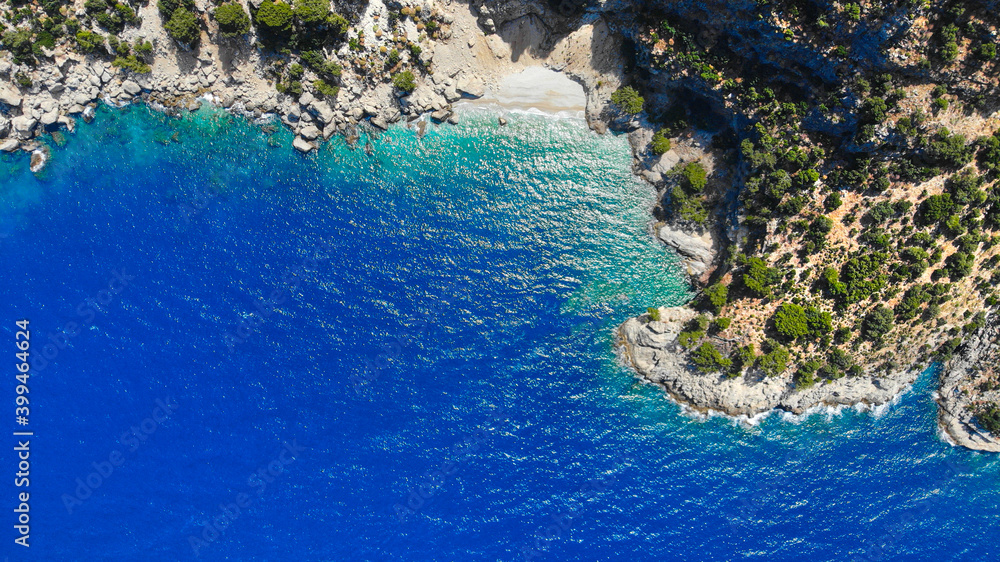 Aerial view of sea water and beautiful bay among the rocks. Mediterranean nature top view from drone.