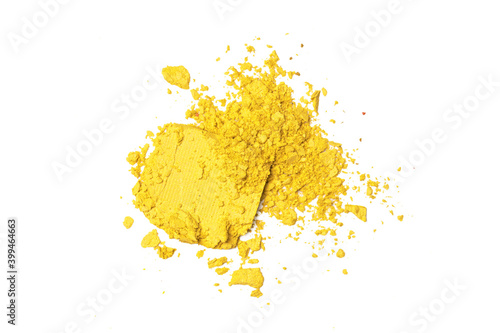 Φωτογραφία Yellow broken eyeshadows isolated on white background
