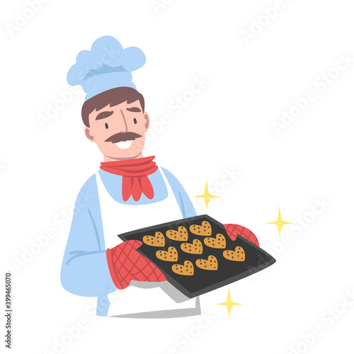 Chef Holding Tray with Freshly Baked Cookies, Cook Character in Hat and Apron Cooking in the Kitchen Cartoon Style Vector Illustration
