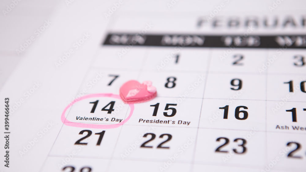 Selected focus love symbol heart shape greeting event holiday, bright white calendar 14 February. Concept for lover Valentine's Day inscription numbers. Pink circle reminder Selected focus love symbol heart shape greeting event holiday, bright white calendar 14 February. Concept for lover Valentine's Day inscription numbers. Pink circle reminder