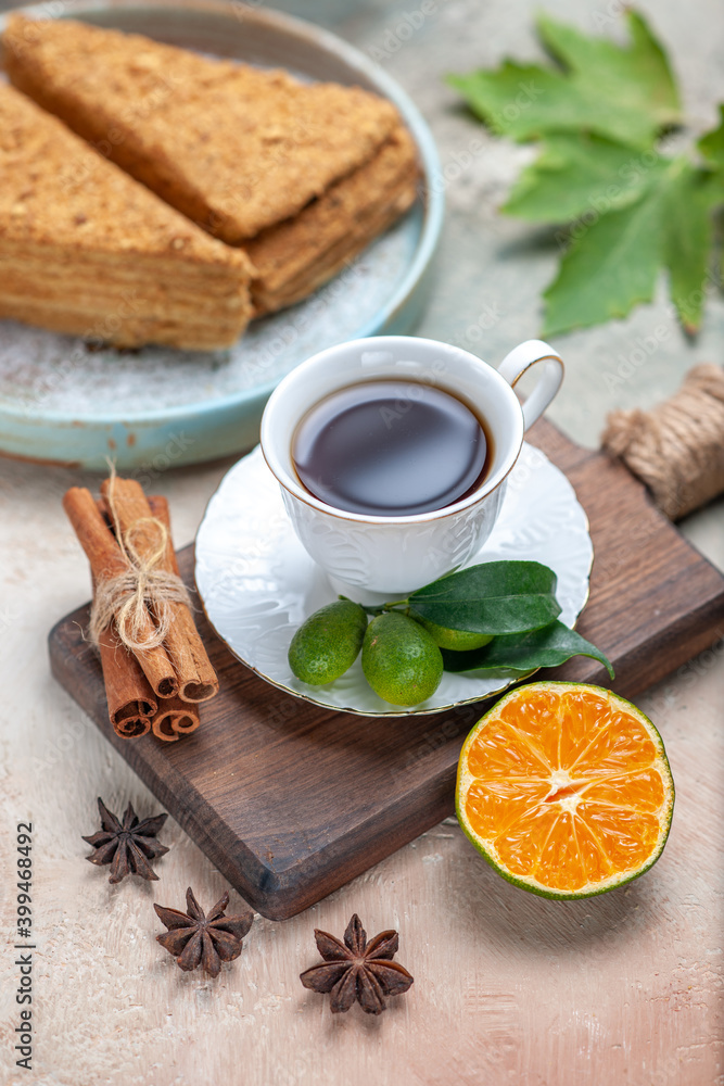 top view delicious honey cake with cup of tea on light background cake pie biscuit sweets top view delicious honey cake with cup of tea on light background cake pie biscuit sweets