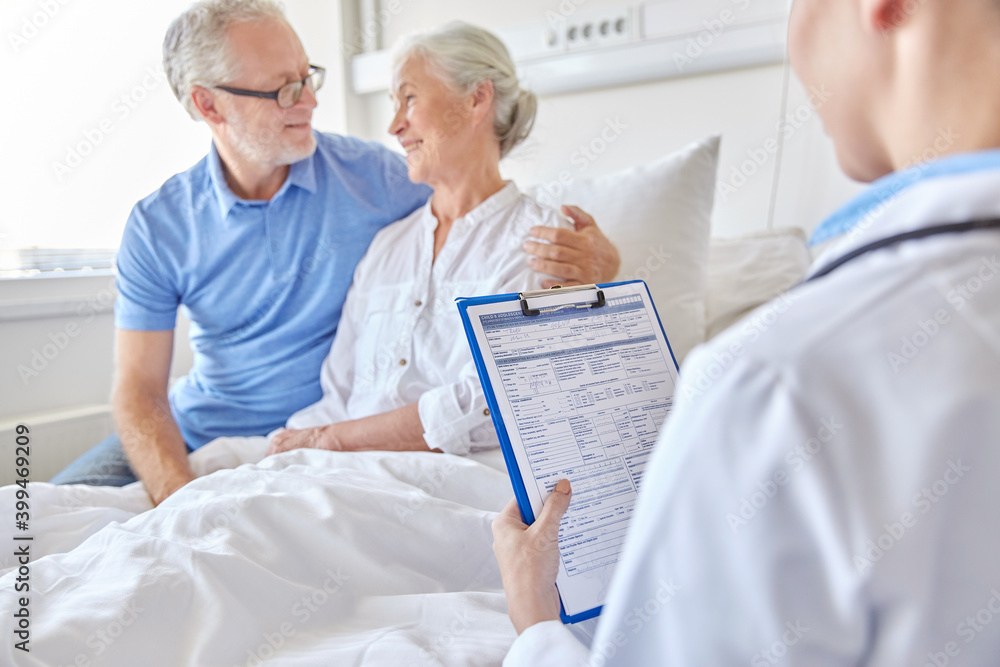 Fototapeta premium medicine, age, health care and people concept - senior woman, man and doctor with clipboard at hospital ward