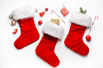 Composition with Christmas socks on white background