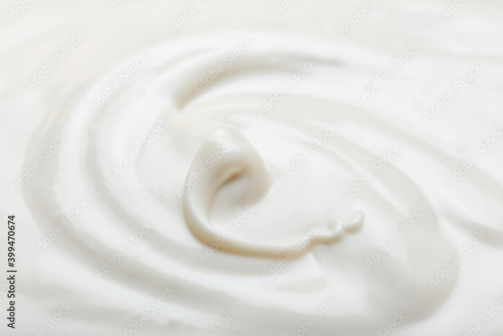 Liquid white chocolate on white background Liquid white chocolate on white background
